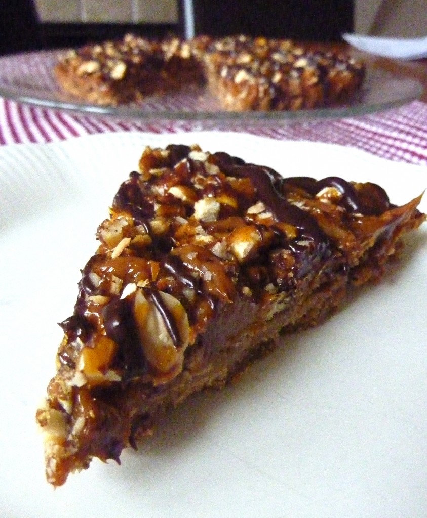 This Browned Butter Dulce De Leche Tart has a shortbread tart crust covered in dulce de leche, candied nuts, and topped off with a chocolate drizzle!