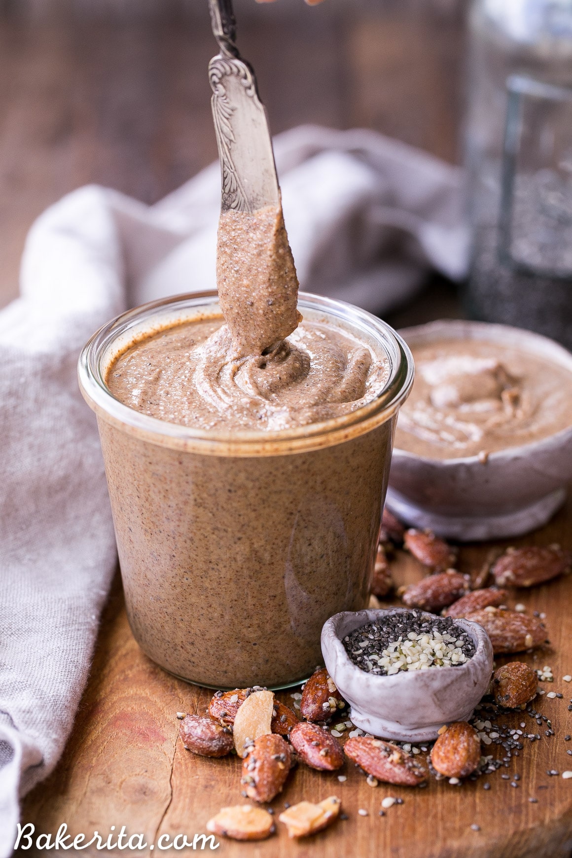 This Maple Almond Butter is made with maple roasted almonds and a hint of vanilla, and made even more nutritious with sunflower seeds, chia seeds, flax seeds, and hemp seeds! You're going to want to spread this almond butter on everything.