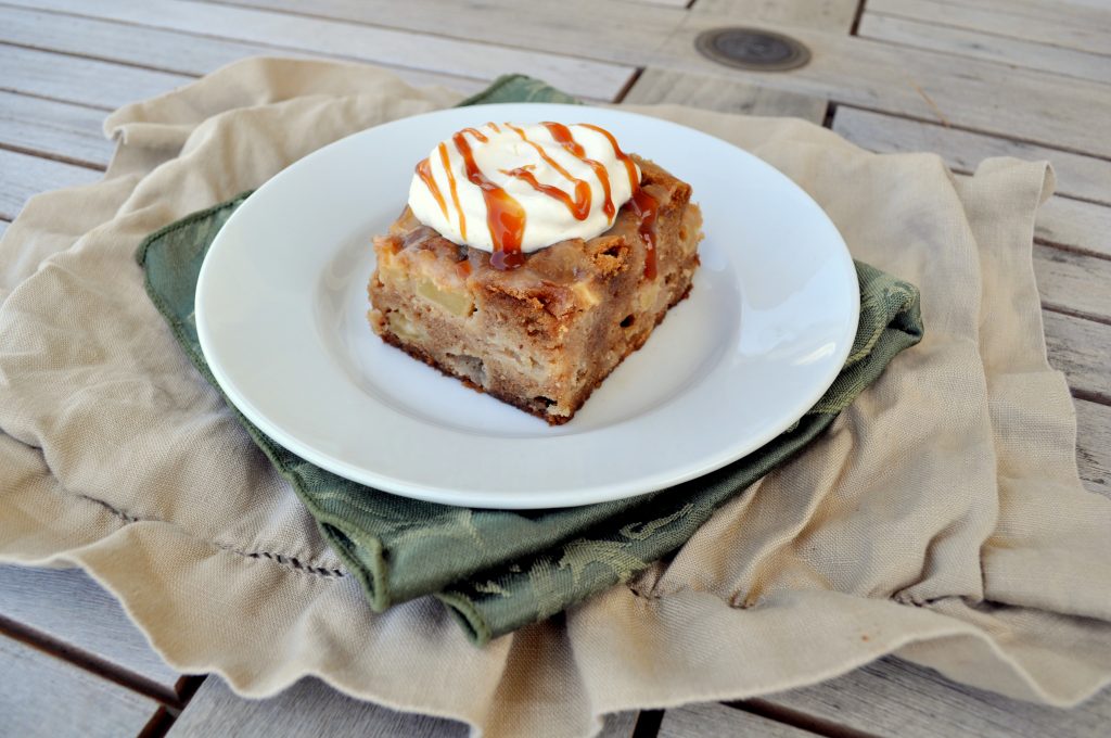 This Caramel-Glazed Apple Cake is an amazingly moist and delicious apple cake full of spices and topped with caramel sauce and caramel whipped cream!