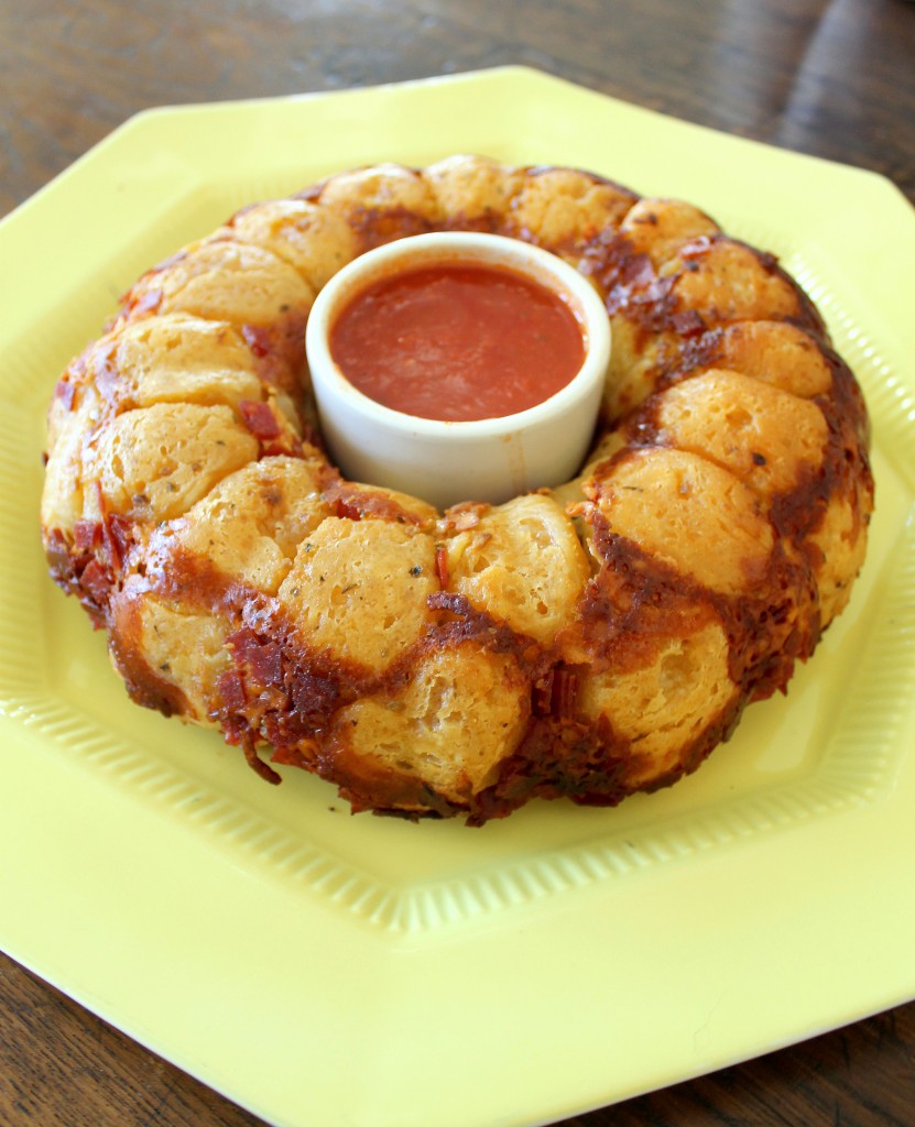 This Pepperoni Pizza Monkey Bread is a savory twist on the sweet classic! Full of gooey mozzarella and pepperoni, this easy recipe won't disappoint.