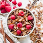 This Coconut Pecan Granola is a flavorful, crunchy, and just lightly sweetened with maple syrup. This gluten-free, refined sugar-free, and vegan granola is perfect for stirring into your yogurt, serving with milk or eating on its own as a snack.