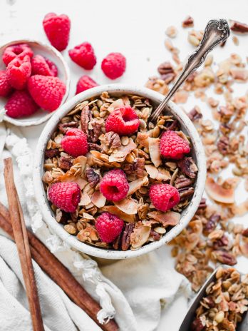 This Coconut Pecan Granola is a flavorful, crunchy, and just lightly sweetened with maple syrup. This gluten-free, refined sugar-free, and vegan granola is perfect for stirring into your yogurt, serving with milk or eating on its own as a snack.