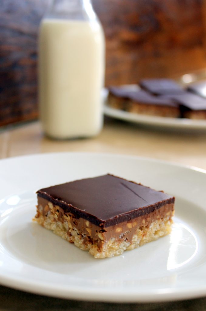 The recipe for these Chocolate Peanut Butter Crispy Bars makes a delicious dessert that is oozing with creamy peanut butter and chocolate over a crunchy layer of rice krispies.