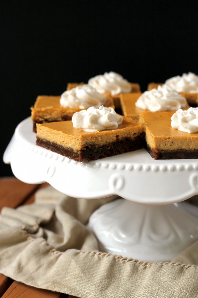 These Gingersnap Pumpkin Cheesecake Bars have a crunchy gingersnap cookie crust topped with a luscious, smooth pumpkin cheesecake filling.