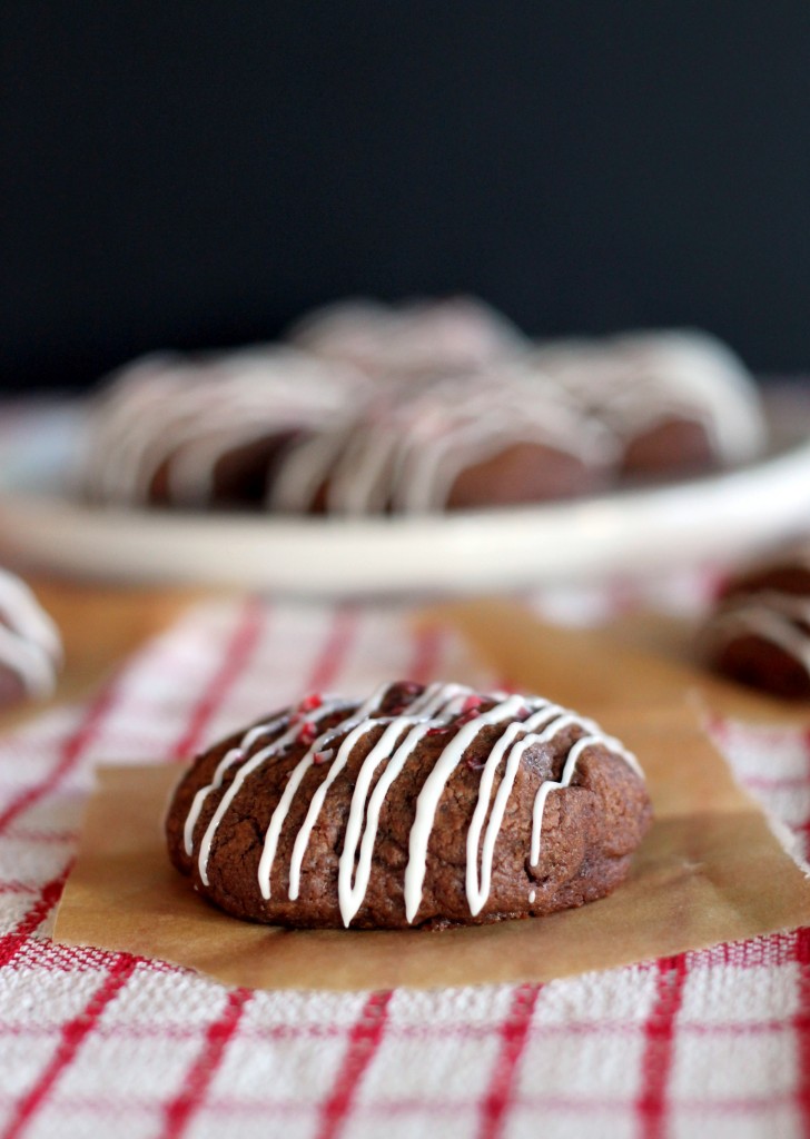 These Chocolate Peppermint Patty Cookies are delicious, fudgy chocolate cookies stuffed with a peppermint patty and topped with crushed candy canes and a peppermint drizzle.