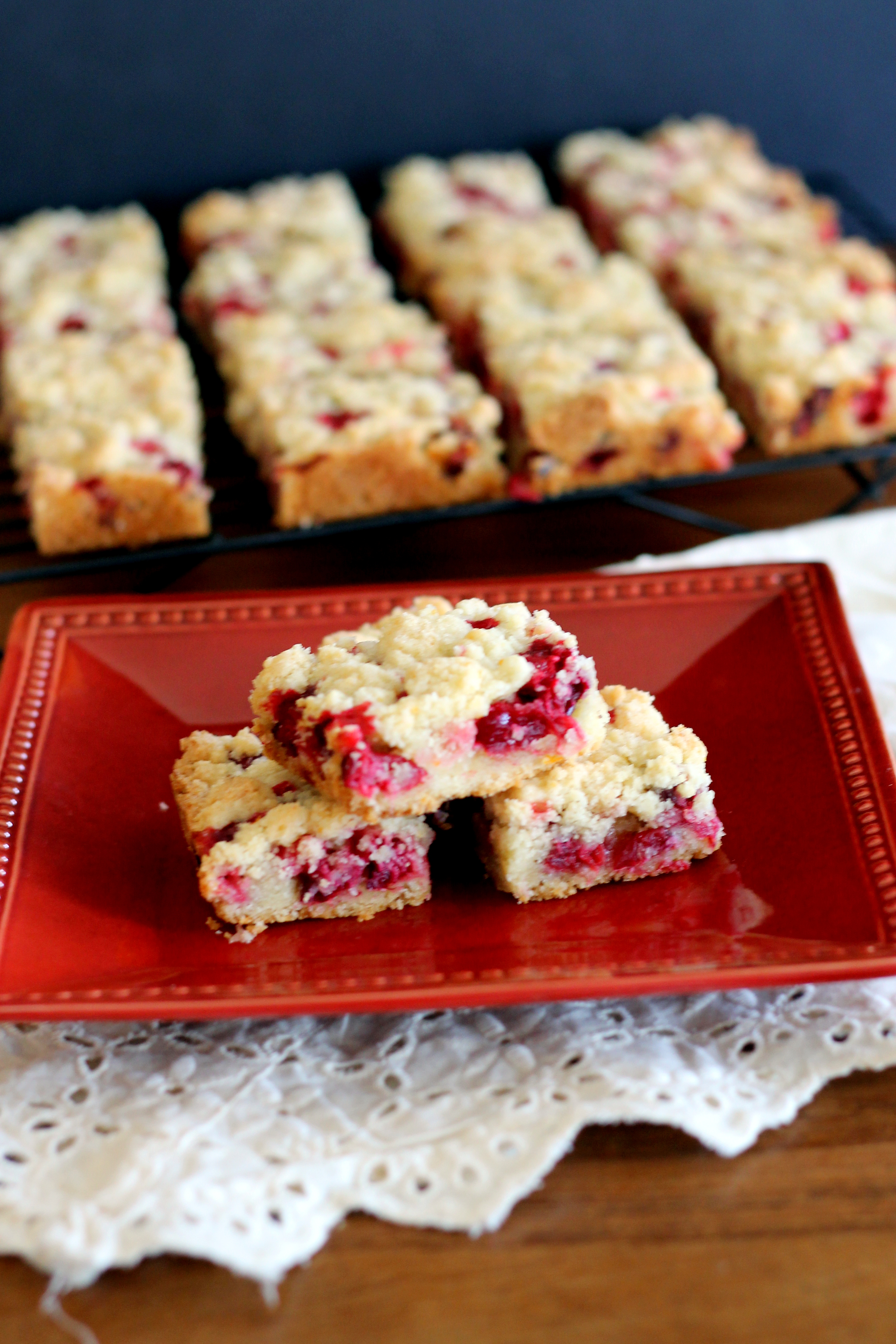 These easy Cranberry Crumb Bars are super portable, super delicious, and perfect for your holiday cookie platters!