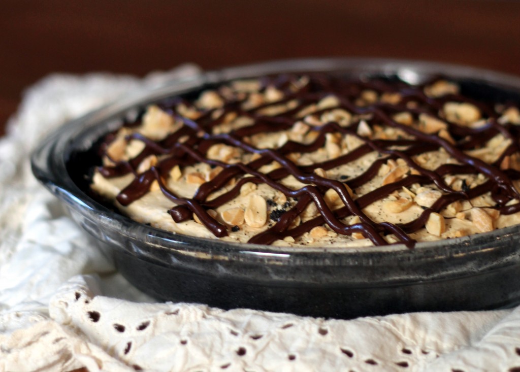 This Chocolate Peanut Butter Mousse Pie has an Oreo crust, a creamy peanut butter mousse, and a drizzle of chocolate and peanuts! No baking required for this easy recipe.