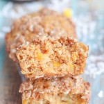 These Mango Coconut Crumble Muffins are tender and full of tropical flavor! These vegan muffins use coconut oil, coconut flakes, and fresh diced mango for a treat that will make you feel like you're on vacation.