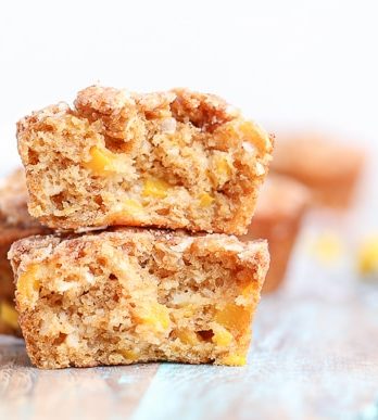 These Mango Coconut Crumble Muffins are tender and full of tropical flavor! These vegan muffins use coconut oil, coconut flakes, and fresh diced mango for a treat that will make you feel like you're on vacation.