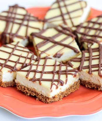 This easy recipe for Cheesecake Bars makes a simple dessert bar that is super creamy, so delicious, and is way easier than making a whole cheesecake!