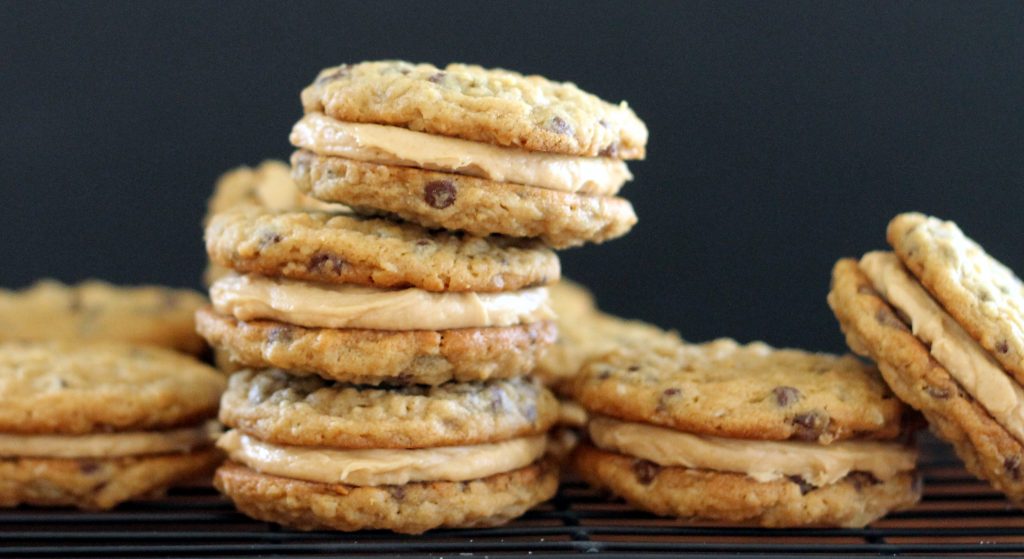  These Peanut Butter Oatmeal Chocolate Chip Cookie Sandwiches are chewy oatmeal cookies sandwiched with a creamy peanut butter frosting. 