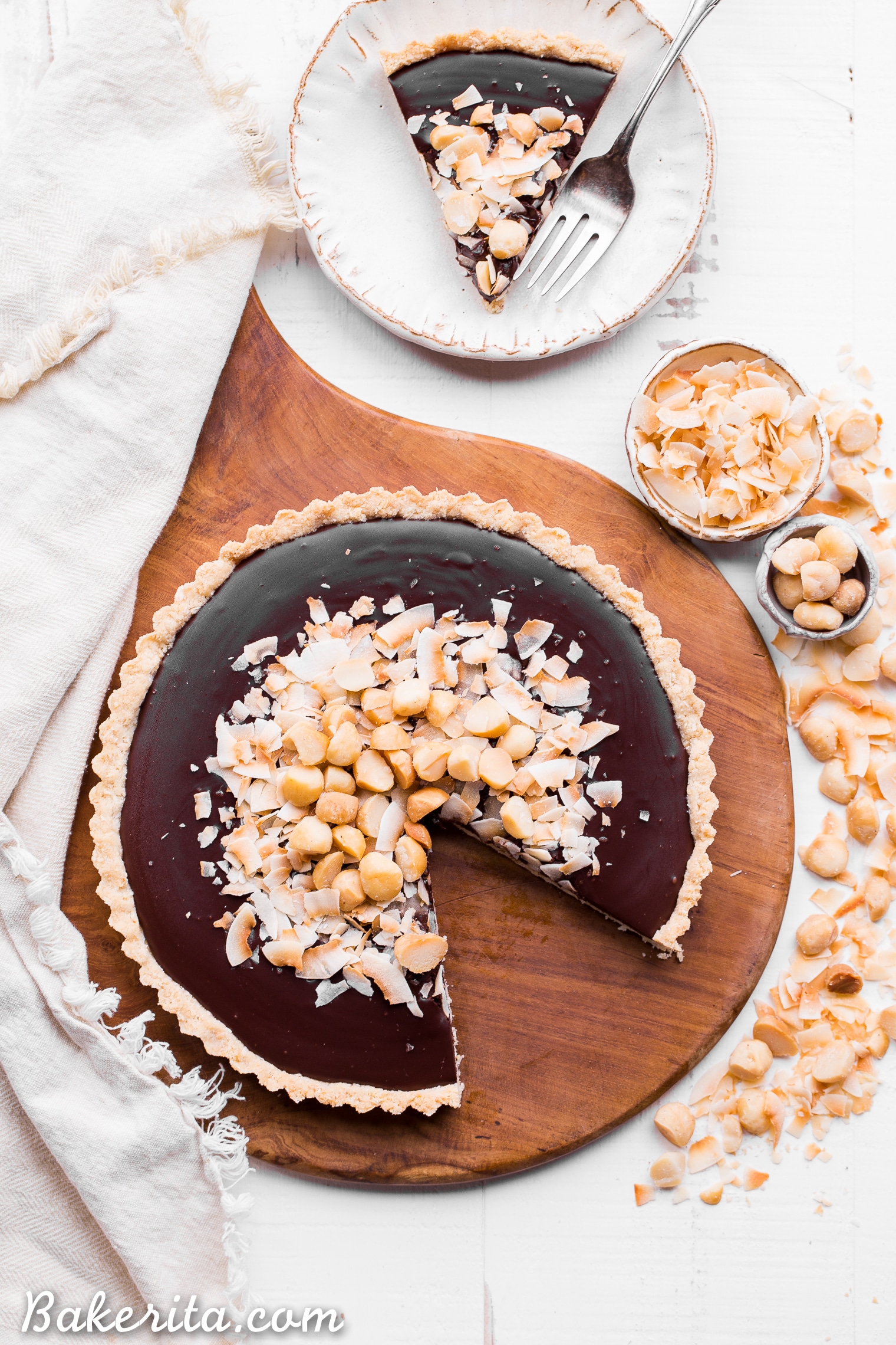 This Dark Chocolate, Coconut & Macadamia Nut Tart is decadent, delicious and easy to make. It has a coconut crust that's filled with a luscious chocolate ganache and topped with toasted coconut and macadamia nuts. You'd never guess that this nutty tart is gluten-free, vegan, Paleo, and refined sugar-free!