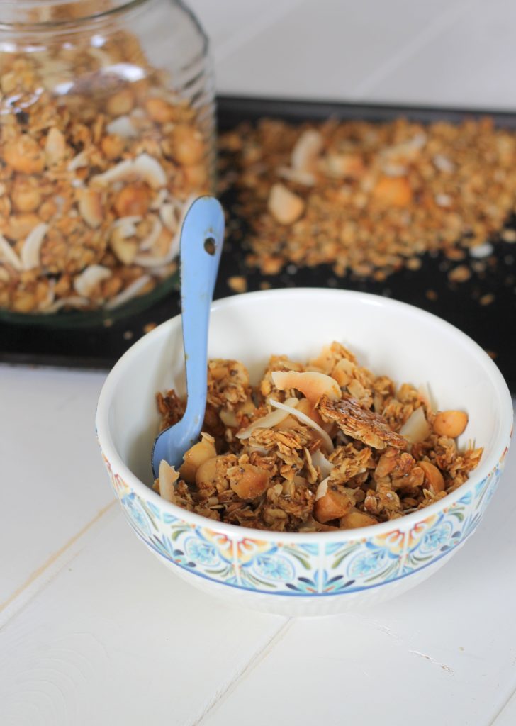 This Coconut Macadamia Nut Granola is the perfect breakfast or snack. Paired with yogurt and berries, this is my favorite breakfast! This easy recipe is gluten free, vegan, and refined sugar free.