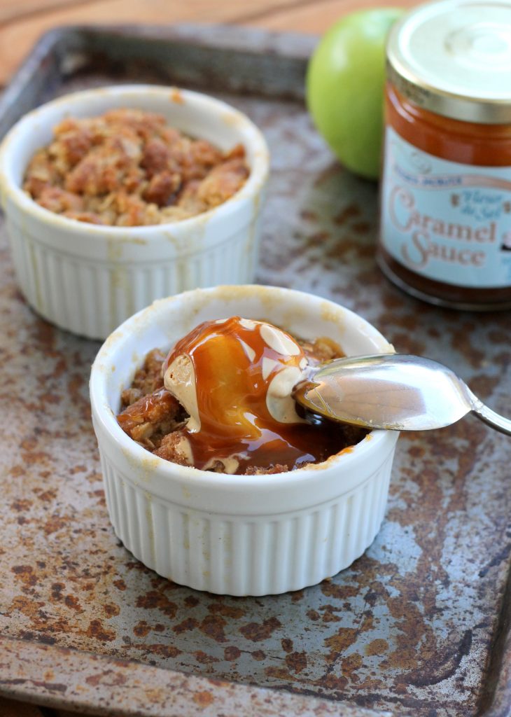 This Caramel Apple Crumble features spiced, caramel-coated apples and a deliciously crunchy & buttery crumble topping. This easy recipe is also gluten-free!