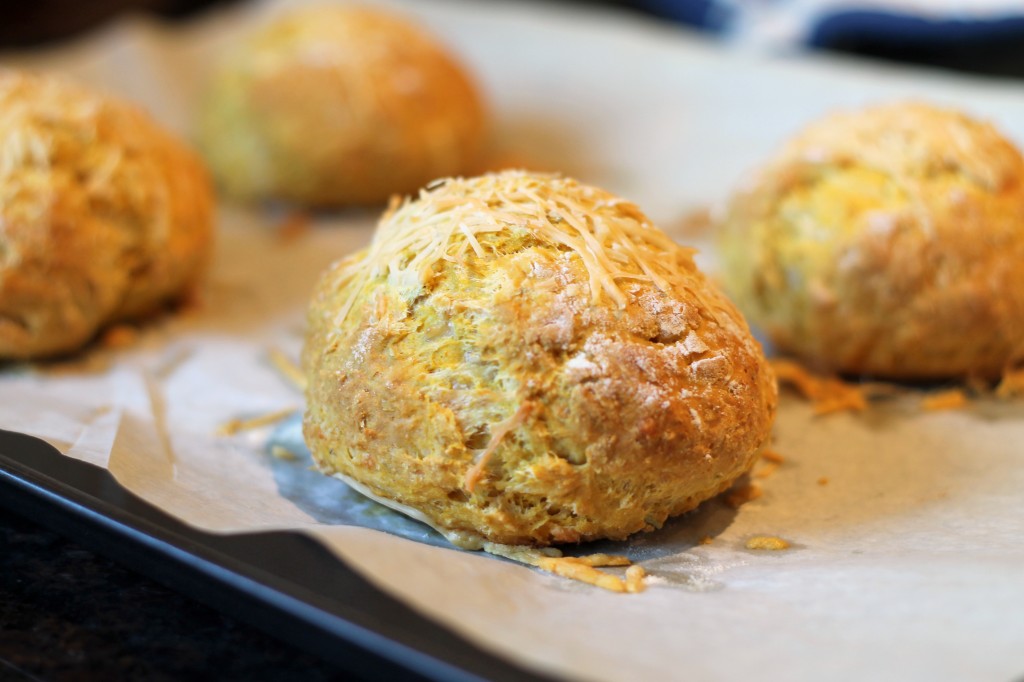 These easy, no-yeast Pumpkin Parmesan Bread Rolls are filled with herbs and topped with cheese. These are the perfect soup companion!