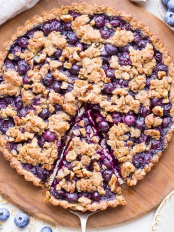 This Blueberry Crisp Tart with Oatmeal Crust comes together quickly and easily, and it's the perfect use for your fresh blueberries! This simple recipe is gluten-free & vegan.
