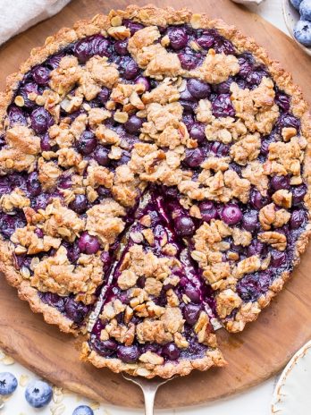 This Blueberry Crisp Tart with Oatmeal Crust comes together quickly and easily, and it's the perfect use for your fresh blueberries! This simple recipe is gluten-free & vegan.