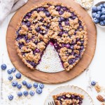 This Blueberry Crisp Tart with Oatmeal Crust comes together quickly and easily, and it's the perfect use for your fresh blueberries! This simple recipe is gluten-free & vegan.