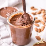 This Dark Chocolate Coconut Almond Butter is a decadent homemade nut butter that will satisfy all your chocolate cravings. This paleo and vegan chocolate spread is perfect with bananas, apples, oatmeal, or with a spoon!
