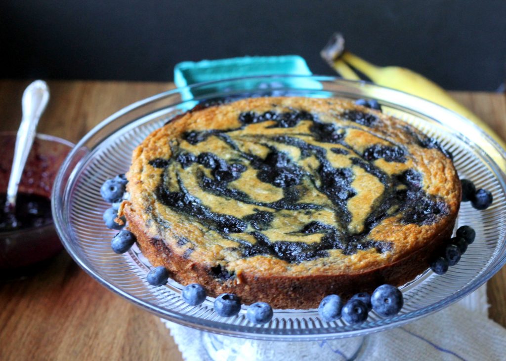 This Paleo Banana Blueberry Swirl Cake has a blueberry compote swirled throughout, for a moist and tender cake that's also gluten-free and Paleo! This easy recipe is healthy enough to enjoy for breakfast. #paleocake #bluberrycake #paleo #glutenfree #dairyfree 