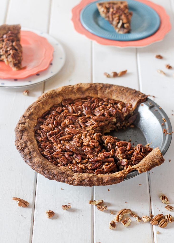 This Paleo Pecan Pie is a healthier version of a holiday favorite! This recipe is a gluten-free & grain-free alternative to traditional pecan pie with the best Paleo pie crust I've ever tried. This is the perfect paleo Thanksgiving dessert.