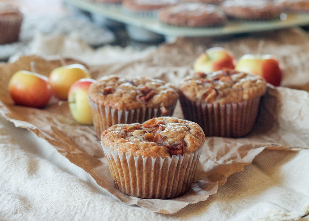 These Apple Oatmeal Muffins are naturally vegan and absolutely full of apple flavor from sautéed apples, apple cider, and applesauce! These healthier muffins are sure to be a breakfast favorite.