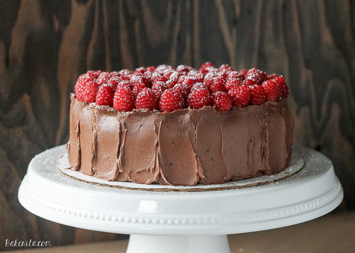 This Mocha Raspberry Cake has two layers of moist chocolate cake, a layer of sweet raspberry filling, frosted with a silky mocha buttercream and topped with fresh raspberries! This impressive cake is perfect for celebrating. 