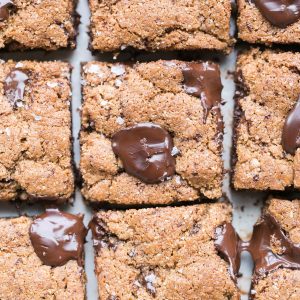 These Paleo Chocolate Chip Blondies have amazing crispy edges, a soft, chewy center and tons of dark, melted chocolate chunks! You'll go crazy for these paleo, gluten-free and refined sugar free blondies.