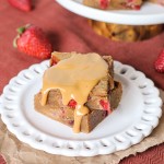 Fresh strawberries and strawberry jelly are swirled into soft peanut butter blondies to create these Peanut Butter & Jelly Bars that taste just like your favorite childhood sandwich! They're super easy and come together in one-bowl.