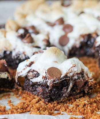 These S'mores Brownies are super fudgy chocolate brownies swirled with marshmallow fluff and milk chocolate chips, baked on a graham cracker crust and topped with toasted mini marshmallows.