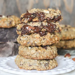 These Nutella Stuffed Oatmeal Hazelnut Chocolate Chip Cookies are loaded with dark chocolate and sprinkled with sea salt. Crunchy toasted hazelnuts and Nutella make these chewy oatmeal chocolate chip cookies even more drool worthy!