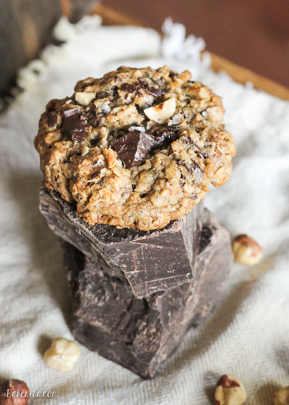 These Nutella Stuffed Oatmeal Hazelnut Chocolate Chip Cookies are loaded with dark chocolate and sprinkled with sea salt. Crunchy toasted hazelnuts and Nutella make these chewy oatmeal chocolate chip cookies even more drool worthy!