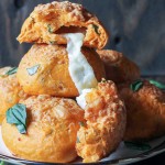 These Cheesy Tomato Basil Rolls are packed full of tomato flavor and fresh basil with gooey mozzarella cheese melting out of the middle and a Parmesan crust on top! These are the perfect snack or soup accompaniment.