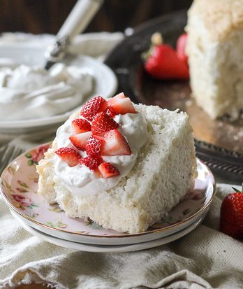 This Vanilla Bean Angel Food Cake is light and airy, with a pure vanilla scent from the vanilla beans flavoring the cake. It's the perfect light dessert when served with berries and whipped cream.