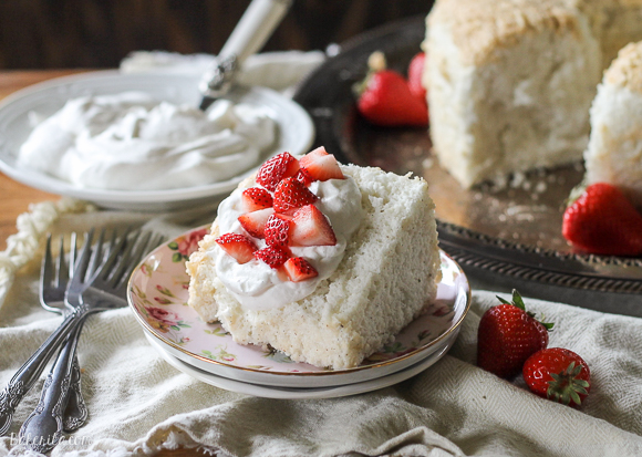 This Vanilla Bean Angel Food Cake is light and airy, with a pure vanilla scent from the vanilla beans flavoring the cake. It's the perfect light dessert when served with berries and whipped cream.