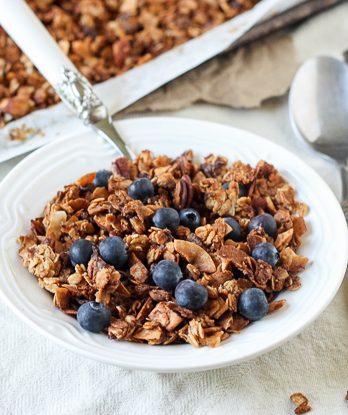 This Banana Coconut Granola tastes warm and tropical, and is full of crunch from the coconut flakes and pecans! It makes the perfect snack by itself, or mix it into some yogurt for the perfect breakfast.