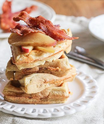 This Cheddar, Apple and Bacon Waffle is a sweet and savory spin on your favorite breakfast indulgence. Served with sautéed apples and syrup for an unforgettable breakfast or brunch!