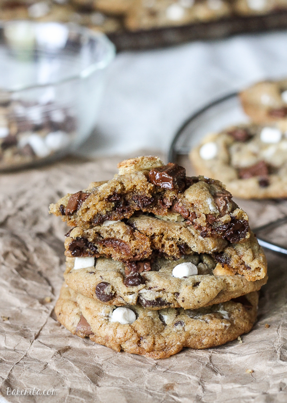 Skip the campfire and whip up a batch of S'mores Cookies! Made with graham cracker cookie dough, chocolate chips & marshmallow bits, these s'mores cookies taste just like your favorite summer treat so you can have s'mores year round.