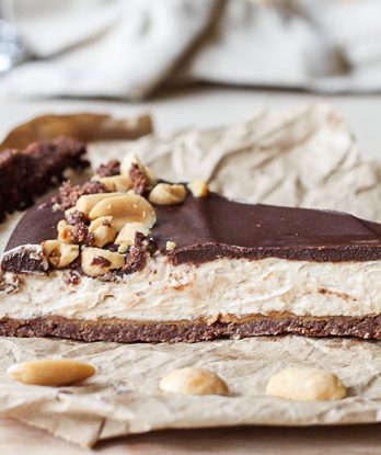 This No Bake Chocolate Peanut Butter Tart has a rich peanut butter filling topped with chocolate ganache for a decadent treat you won't believe is gluten free, refined sugar free, and vegan!