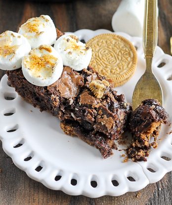 This S'mores Oreo Skillet Brownie has a graham cracker & S'mores Oreo crust with a gooey, fudgy brownie center and toasted marshmallows.