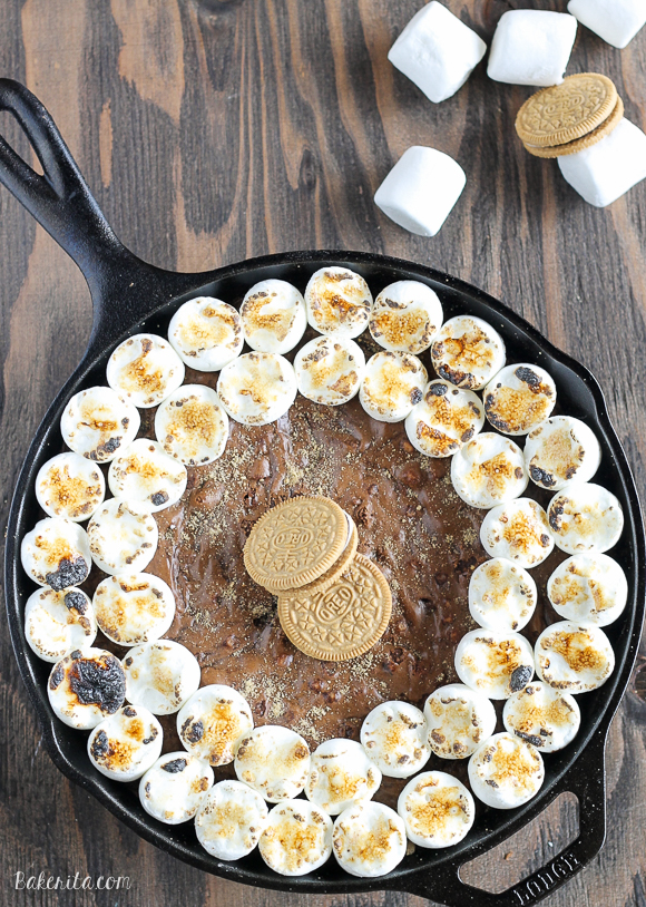 This S'mores Oreo Skillet Brownie has a graham cracker & S'mores Oreo crust with a gooey, fudgy brownie center and toasted marshmallows. 