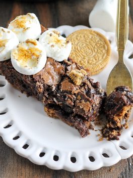 This S'mores Oreo Skillet Brownie has a graham cracker & S'mores Oreo crust with a gooey, fudgy brownie center and toasted marshmallows.