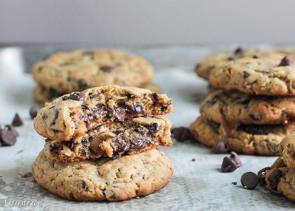 These big Peanut Butter Chocolate Chip Caramel Filled Cookies are soft and chewy peanut butter oatmeal cookies studded with chocolate chips, surrounding a chocolate covered caramel!