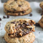 These big Peanut Butter Chocolate Chip Caramel Filled Cookies are soft and chewy peanut butter oatmeal cookies studded with chocolate chips, surrounding a chocolate covered caramel!