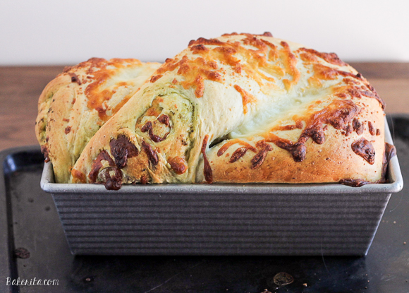Gooey mozzarella cheese and pesto are swirled throughout a light and fluffy yeast bread to make this Cheesy Pesto Swirl Bread you won't be able to get enough of! Put a slice in the toaster for a delicious snack.