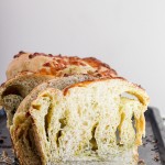Gooey mozzarella cheese and pesto are swirled throughout a light and fluffy yeast bread to make this Cheesy Pesto Swirl Bread you won't be able to get enough of! Put a slice in the toaster for a delicious snack.
