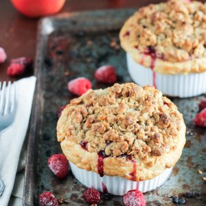 These Mini Apple Berry Crumble Pies are bursting with tart, juicy berries and tender apple slices, topped with a delectably crunchy crumble topping! Serve with ice cream for the best treat.