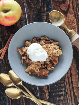 This classic Apple Crisp is made with firm, lightly sweetened and spiced apples and topped with a crispy crumble topping with oats and pecans. It's baked in a skillet and best served with vanilla ice cream!