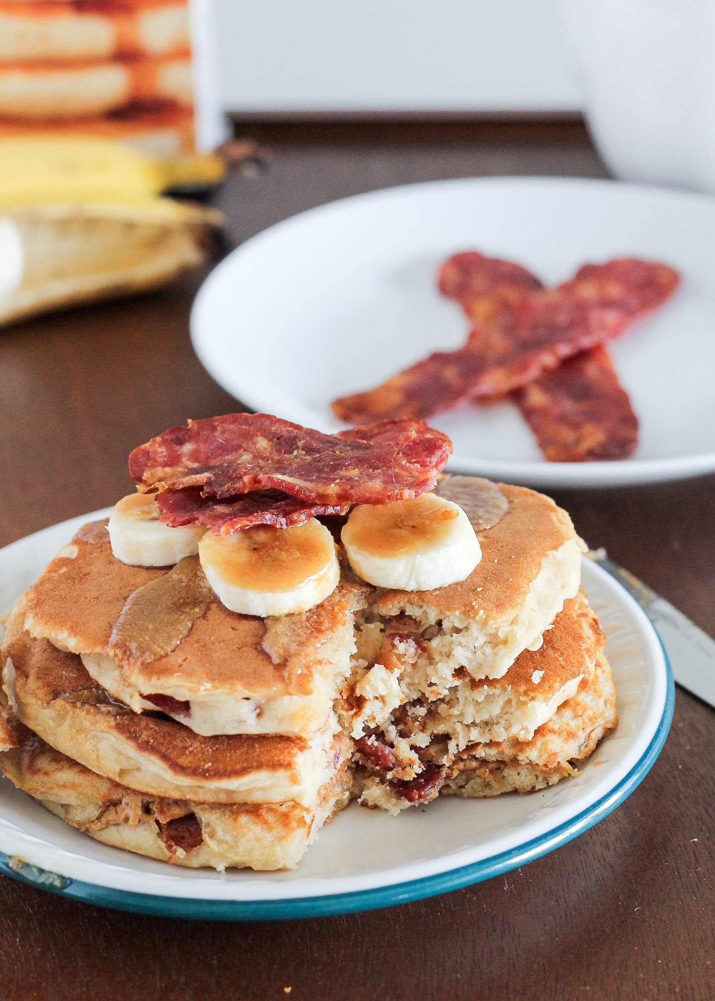 These Elvis Pancakes are banana peanut butter pancakes stuffed with peanut butter and bacon. These are the ultimate breakfast treat - made with only 4 ingredients!