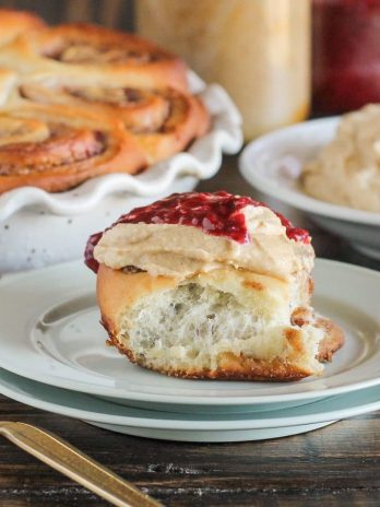 These Peanut Butter & Jelly Cinnamon Rolls are a delicious twist on a classic breakfast treat. These cinnamon rolls are filled with peanut butter and jelly and topped with a peanut butter cream cheese frosting.